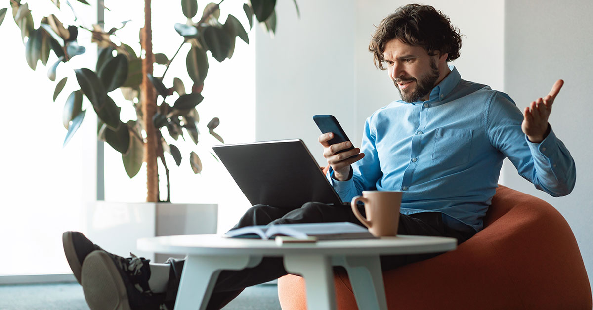 frustrated man shopping online using his phone